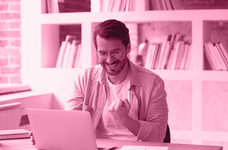 man happy at his laptop